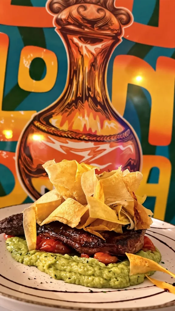 Grilled meat over guacamole at Tequendama Las Rozas