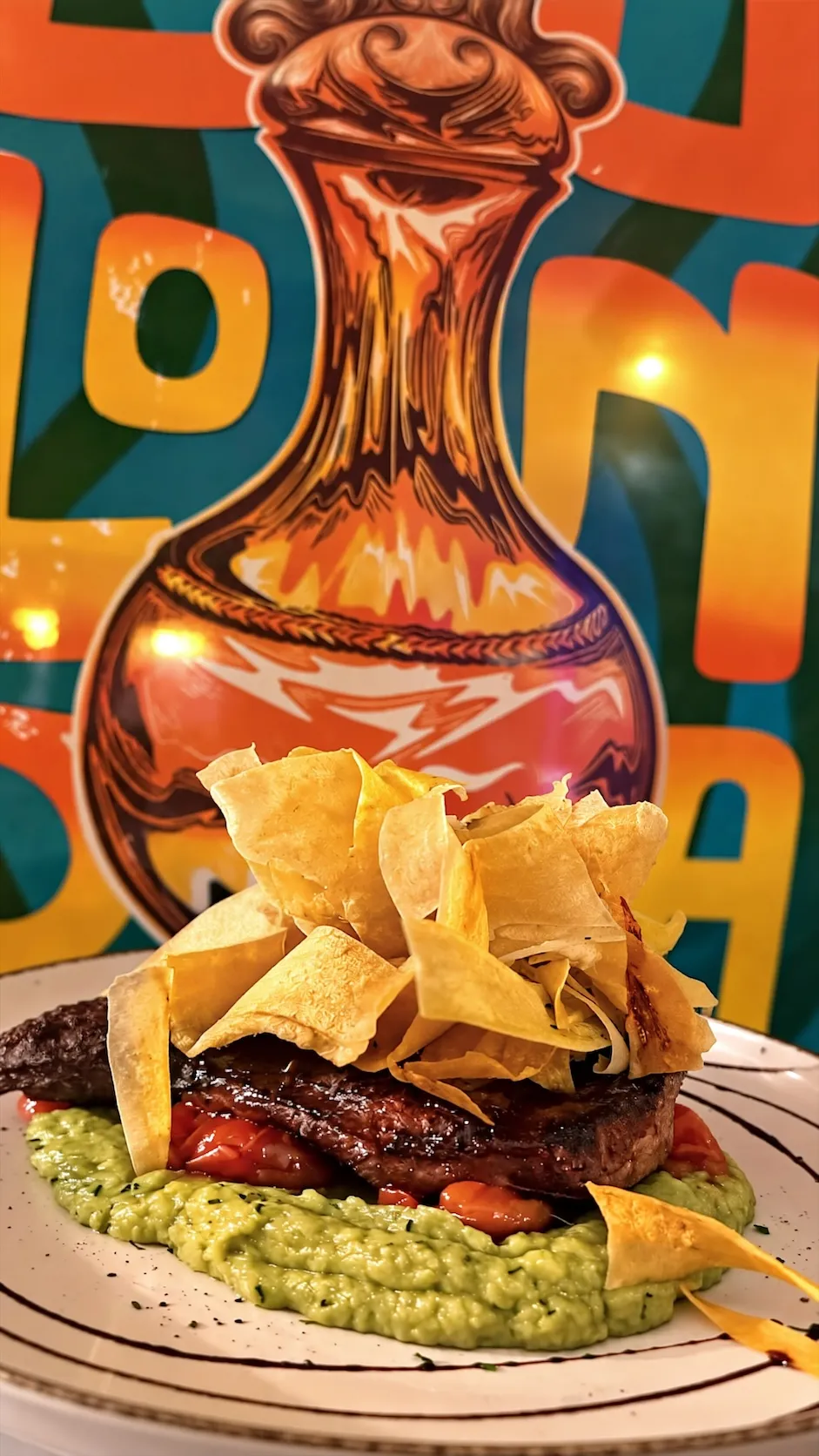 Grilled meat over guacamole at Tequendama Las Rozas